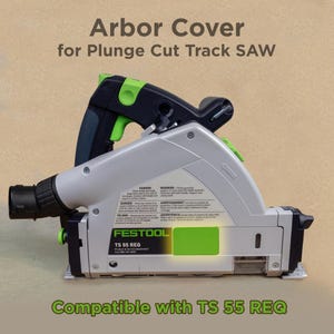 May include: A green and gray arbor cover for a plunge cut track saw. The cover is compatible with the Festool TS 55 REQ saw. The cover has a warning label with text in multiple languages.