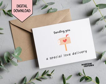May include: A white card with the text "Sending you a special love delivery" and a cartoon illustration of a mailbox with a heart on it. The card has the text "Wundering Craftsmen" at the bottom.