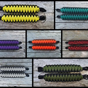May include: Set of 10 paracord door handles in various colors, including black, yellow, green, purple, orange, red, gray, and olive green. Each handle is made of two braided paracord strands.