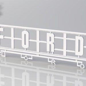 May include: White plastic model kit for building the word "FORD". The kit includes separate pieces for each letter, with tabs and slots for assembly.