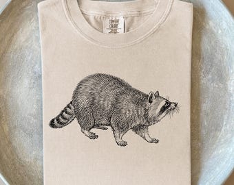 Camiseta vintage de guaxinim: camiseta com ilustração retrô e cores confortáveis