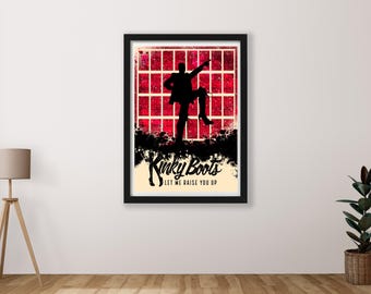 May include: A red and black poster with a silhouette of a person in a dance pose. The poster says "Kinky Boots Let Me Raise You Up".