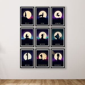May include: A set of nine framed prints featuring silhouettes of Disney princesses against a backdrop of a moon and starry night sky. Each print features a different princess, including Belle, Elsa, Jasmine, Ariel, Merida, Moana, Mulan, Pocahontas, and Rapunzel.