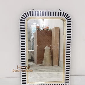May include: Rectangular wall mirror with a black and white striped border. The mirror has a gold-coloured inner frame and a reflective surface. The text "Home Decor Crafts00" is visible at the bottom left.