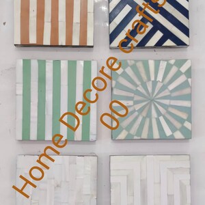 May include: Set of five square coasters made of bone inlay with different geometric patterns. The patterns include stripes, a sunburst design, and a chevron pattern. The coasters are in shades of white, blue, green, and orange.