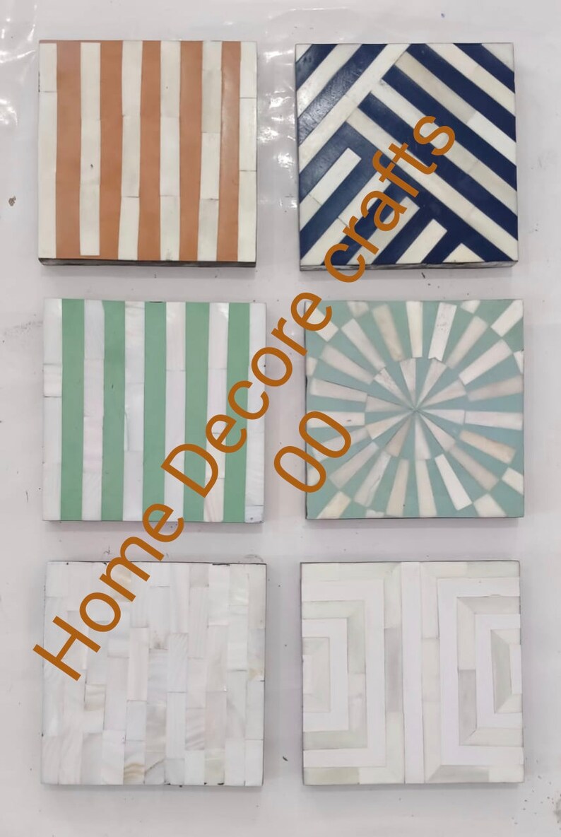 May include: Set of five square coasters made of bone inlay with different geometric patterns. The patterns include stripes, a sunburst design, and a chevron pattern. The coasters are in shades of white, blue, green, and orange.