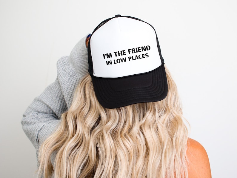 Funny country trucker hat with phrase I’m the Friend in Low Places, unisex adjustable mesh cap, western humor gift for men and women