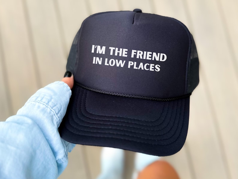 Funny country trucker hat with phrase I’m the Friend in Low Places, unisex adjustable mesh cap, western humor gift for men and women