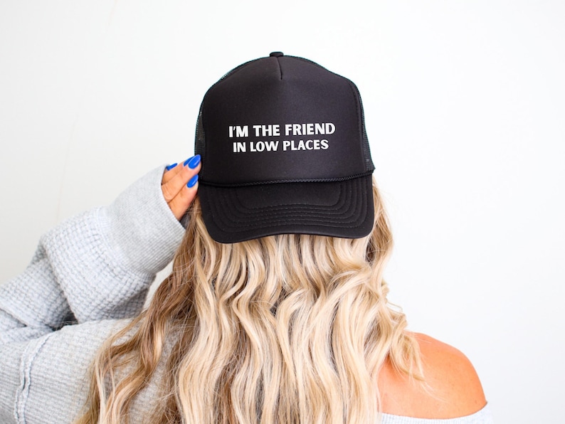 Funny country trucker hat with phrase I’m the Friend in Low Places, unisex adjustable mesh cap, western humor gift for men and women