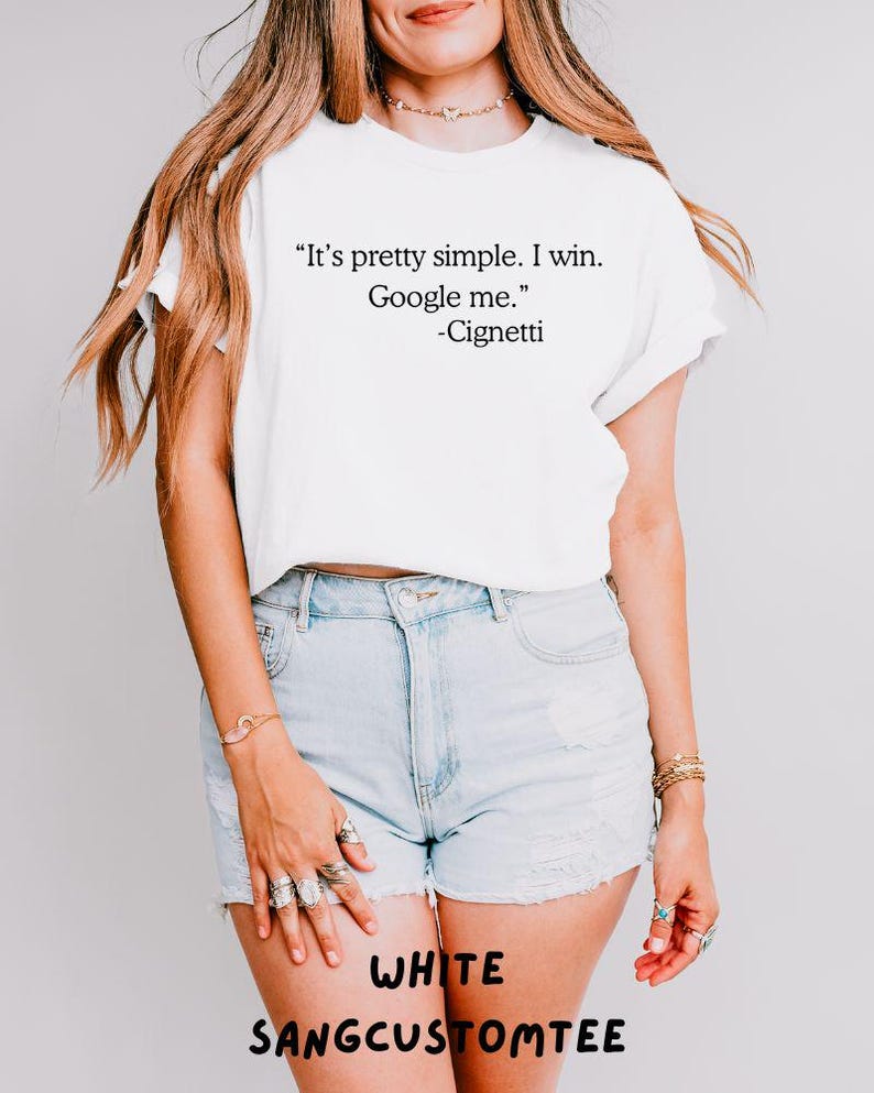 May include: White t-shirt with the quote "It's pretty simple. I win. Google me." and the name "-Cignetti". The text "WHITE SANGCUSTOMTEE" is printed at the bottom. The shirt is paired with light blue denim shorts.