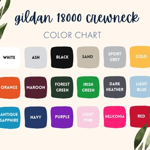 May include: Color chart for Gildan 18000 crewneck sweatshirts. The chart displays a variety of colors, including white, black, orange, maroon, forest green, Irish green, dark heather, light blue, antique sapphire, navy, purple, light pink, heliconia, and red.