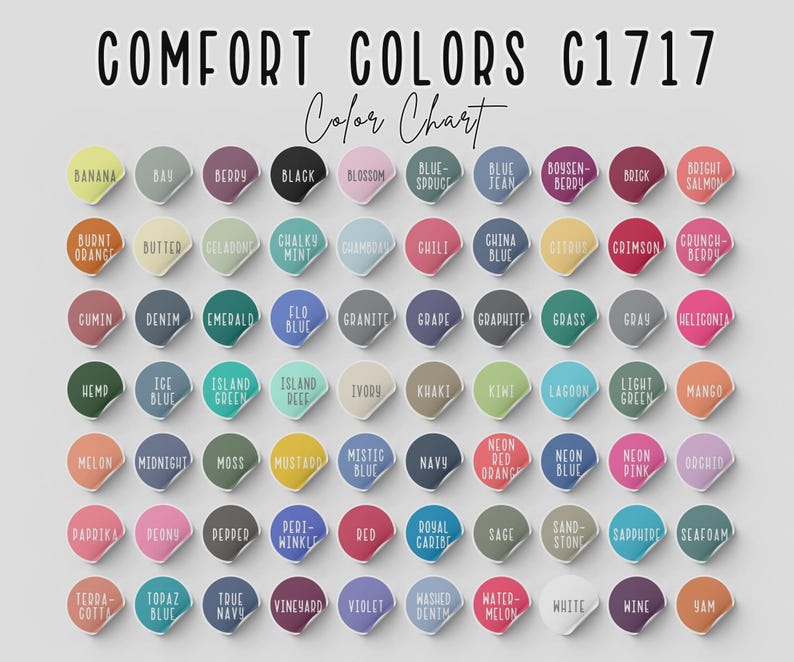 May include: A color chart titled "COMFORT COLORS C1717 Color Chart" displays a variety of colors on circular stickers. Colors include "Banana," "Denim," "Emerald," "Navy," and "Violet." The chart is designed to showcase the available color options.