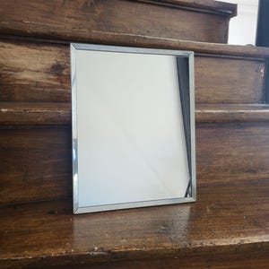 Vintage metal barber mirror