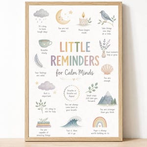 May include: A framed wall art print titled Little Reminders for Calm Minds, featuring pastel illustrations of a cloud, moon, candle, bird, cup, feather, shell, mountain, and rainbow, each paired with short, encouraging text in a light wooden frame.