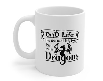 May include: White ceramic mug with a black graphic that reads "DnD Life like normal life but with Dragons." The mug has a curved handle and a cylindrical shape. The design includes a dragon silhouette.