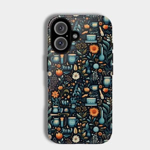 May include: A black phone case with a floral pattern featuring blue, orange, and green colors. The pattern includes flowers, leaves, and small objects like cups and vases.