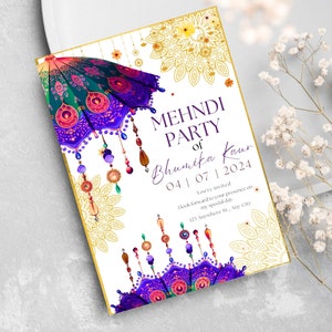 May include: A white invitation card with gold and purple accents. The card features a colorful umbrella with hanging beads and a mandala design. The text on the card reads "Mehndi Party of Bhumika Kaur 04|07|2024 You're invited Look forward to your presence on my special day. 123 Anywhere St, Any City"