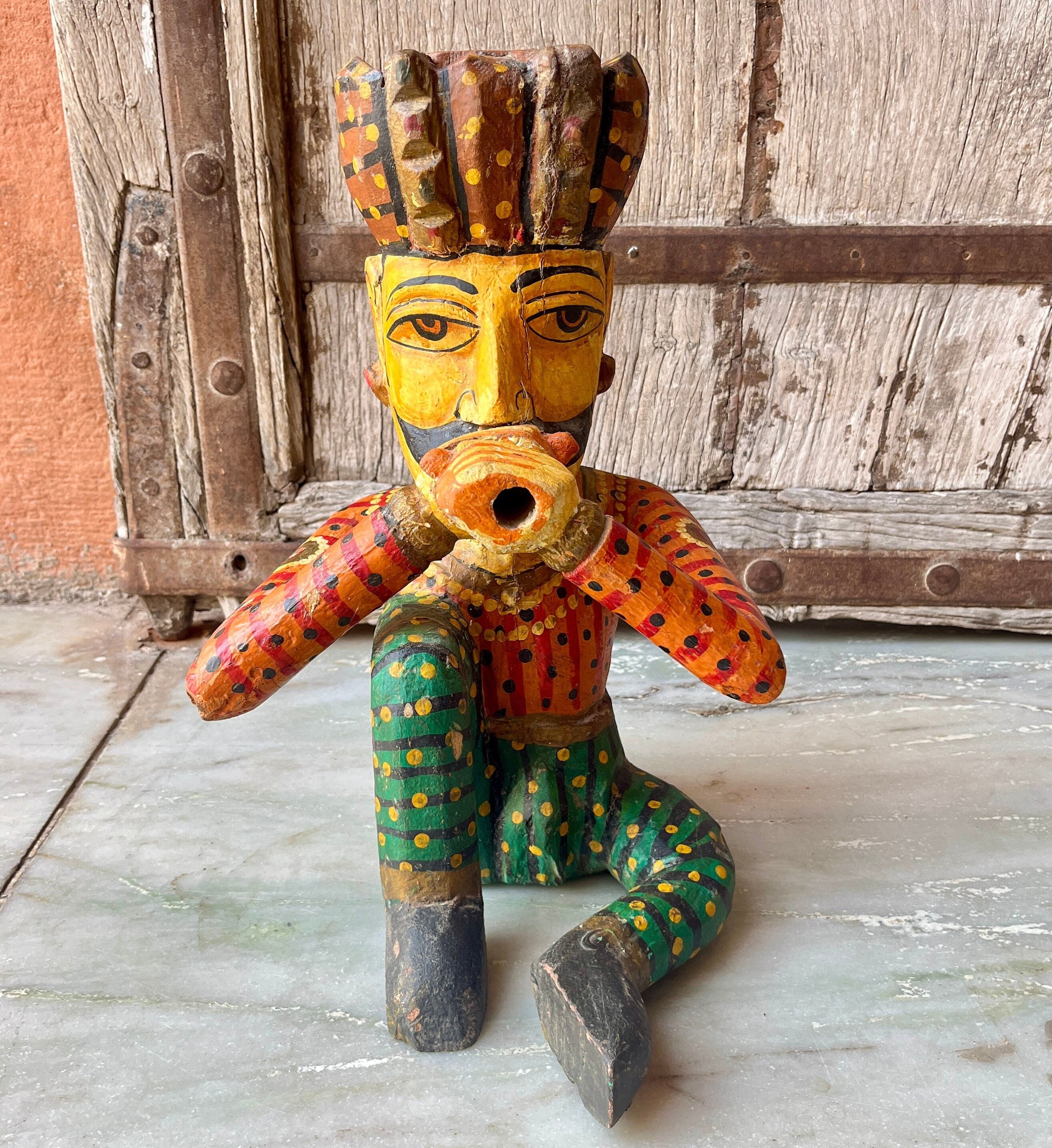 Wooden Gangaur idols display in handicraft shop for retailers