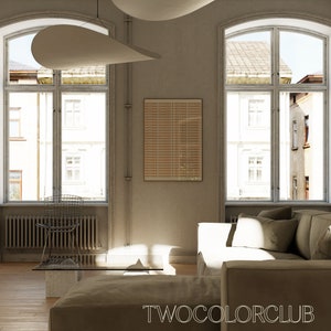 May include: A living room with two large windows, a brown couch, a coffee table, and a chair. The walls are a light beige color and there is a framed print on the wall.
