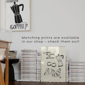 May include: Two black and white illustrations of coffee pots and croissants. The first illustration says "Morning Coffee?" and the second illustration says "Sundays are made for breakfast".
