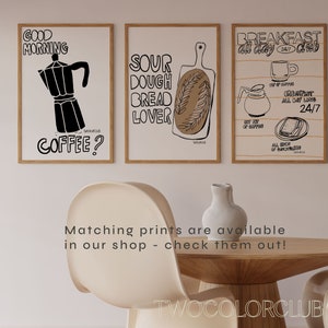 May include: Three black and white illustrations on white paper with wooden frames. The first illustration is a coffee pot with the text "Good Morning Coffee?" The second illustration is a loaf of bread with the text "Sour Dough Bread Lover." The third illustration is a cup of coffee, a pot of coffee, and a sandwich with the text "Breakfast All Day Club 24/7".
