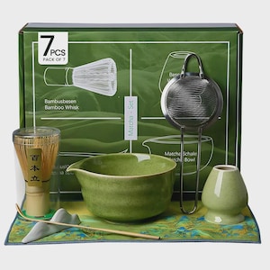 May include: A green matcha set with a bamboo whisk, a bowl, a strainer, a teacup, and a small whisk. The set is packaged in a green box with the text "Matcha - Set" and "7PCS PACK OF 7".
