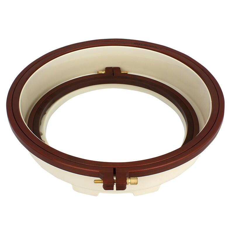 May include: A white and brown embroidery hoop with two adjustable clamps. The hoop is made of plastic and has a smooth, rounded edge.