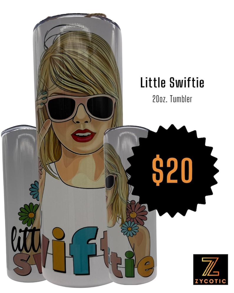 May include: A white 20oz tumbler featuring a cartoon illustration of a woman wearing sunglasses. The tumbler has the words "Little Swiftie" and a price tag of $20. The design includes colorful flowers and the word "Swiftie" in various colors.