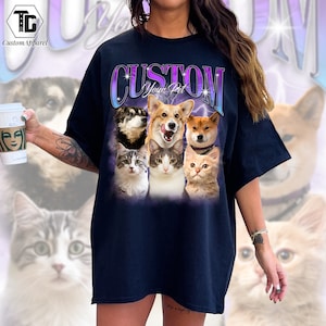 May include: Black t-shirt with a graphic of a group of cats and dogs. The graphic is in a retro style with a purple and blue gradient. The text "CUSTOM Your Pet" is above the graphic.