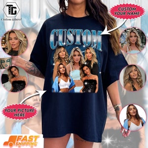 May include: A navy blue t-shirt with the word "CUSTOM" printed in blue and white letters. The shirt features a collage of five women with blonde hair. The shirt is available for customization with a picture and name.