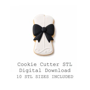 May include: A cookie cutter in the shape of a bow tie. The cookie is white with a black bow tie in the center. The text "Cookie Cutter STL Digital Download 10 STL SIZES INCLUDED" is below the cookie.