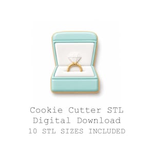 May include: A cookie cutter shaped like a ring in a box. The ring is gold with a diamond-shaped gem. The box is light blue with a white interior and gold trim. Text on the image reads "Cookie Cutter STL Digital Download 10 STL SIZES INCLUDED."
