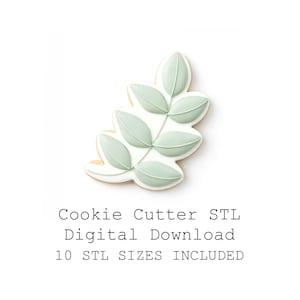 Puede incluir: Un cortador de galletas en forma de hoja con un diseño de hoja verde claro y glaseado blanco. El texto "Cookie Cutter STL Digital Download 10 STL SIZES INCLUDED" está impreso debajo.