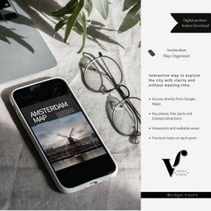 May include: A smartphone shows an "Amsterdam Map" graphic, with round glasses beside it. The image includes text: "Digital product Instant download" and "Interactive map to explore the city with clarity and without wasting time."