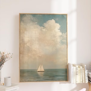a large framed painting of a sailboat on the ocean, hanging on a wall next to a bookshelf filled with books.