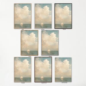a collection of nine framed paintings depicting a serene scene of a sailboat on the water, with a cloudy sky in the background.