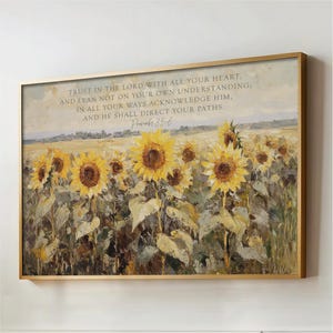 May include: A framed artwork featuring a field of sunflowers in full bloom. The painting has a gold frame and includes the text "TRUST IN THE LORD WITH ALL YOUR HEART... Proverbs 3:5-6". The sunflowers are yellow and brown.