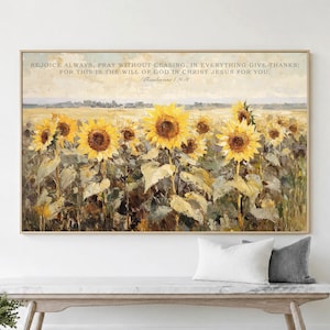 May include: A rectangular wall art print featuring a field of yellow sunflowers under a pale sky. The text REJOICE ALWAYS, PRAY WITHOUT CEASING, IN EVERYTHING GIVE THANKS; FOR THIS IS THE WILL OF GOD IN CHRIST JESUS FOR YOU. 1 Thessalonians 5:16-18 is printed at the top.