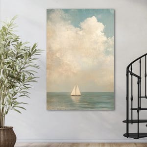 a large painting of a sailboat on the ocean, hanging on a wall next to a potted plant.