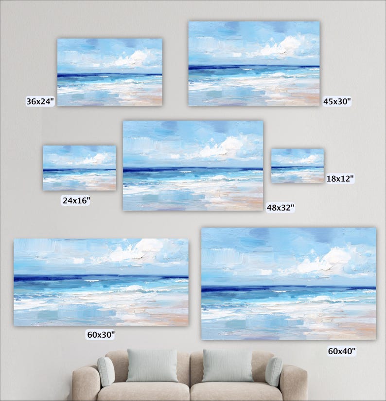 a collection of seven framed paintings depicting a serene beach scene with a blue sky, ocean, and clouds. The paintings vary in size, ranging from 36x24 inches to 48x32 inches. The paintings are arranged in a grid-like pattern on a wall, with each frame showcasing a different perspective of the beach landscape.