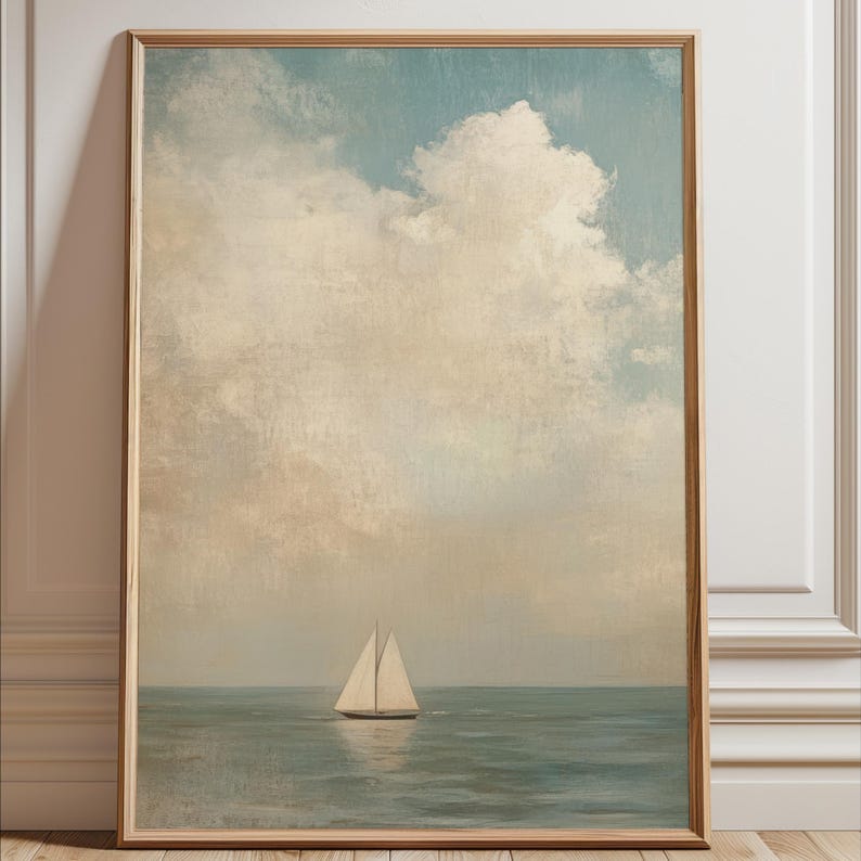 a sailboat on the water, with a cloudy sky in the background.