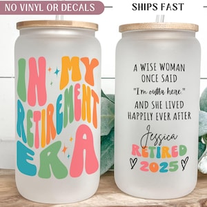 May include: Two frosted glass tumblers with bamboo lids and straws. One tumbler reads "IN MY RETIREMENT ERA" in colorful retro font. The other says "A WISE WOMAN ONCE SAID 'I'm outta here.'" and "Jessica RETIRED 2025".
