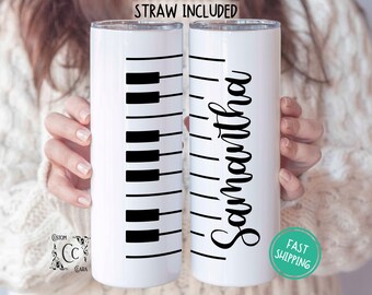 May include: Two white stainless steel tumblers with lids. One tumbler has a black piano key design and the other has the name "Samantha" written in black cursive.