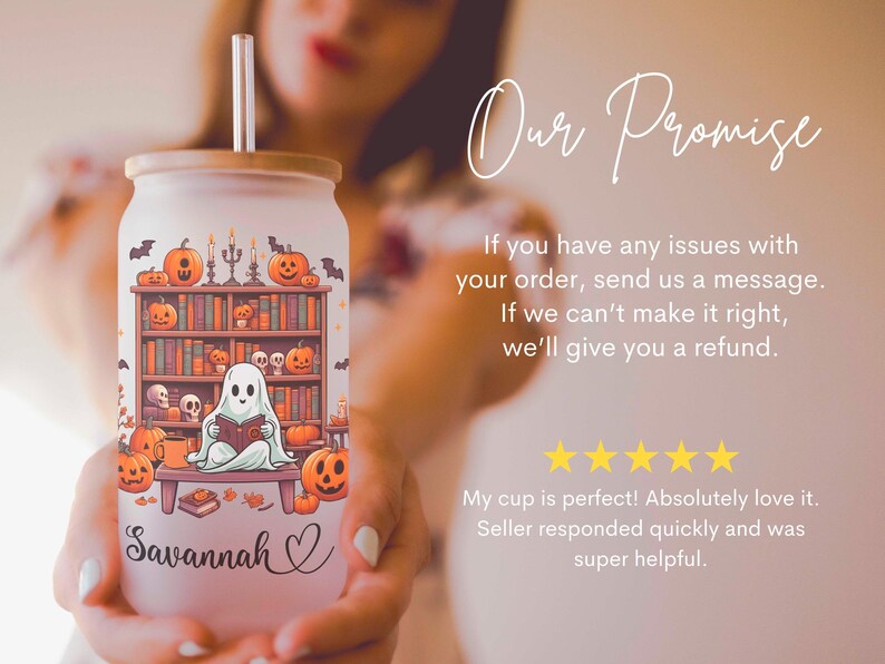 May include: A white tumbler with a Halloween-themed design featuring a ghost reading a book in front of a bookshelf with pumpkins and bats. The tumbler has a bamboo lid and a straw. The name "Savannah" is written on the tumbler.