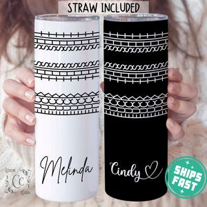 May include: Two stainless steel tumblers, one white and one black, each with a decorative black and white geometric pattern. The white tumbler is personalized with the name "Melinda", and the black tumbler with "Cindy". The text "STRAW INCLUDED" is at the top.