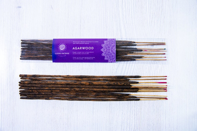 May include: A package of Good Incense Agarwood incense sticks. The package is purple with a mandala design and the text "Premium Masala Incense to make you feel good" and "Agarwood" in white. The sticks are brown and have a natural wood scent.