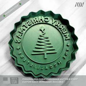 May include: A round green cookie cutter and stamp featuring a scalloped edge, a central Christmas tree graphic, and the embossed text MERRY CHRISTMAS THE MCCALLISTERS. The tool is designed for creating personalized holiday cookies.
