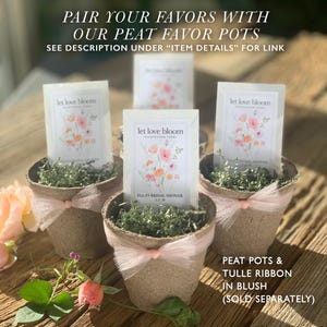 May include: Four peat favor pots filled with greenery and seed packets. Each pot is wrapped with a blush tulle ribbon. The seed packets read "let love bloom" and "ELLA'S BRIDAL SHOWER 3.21.26". The text "PAIR YOUR FAVORS WITH OUR PEAT FAVOR POTS" is at the top.