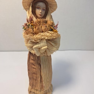Corn Husk Doll Figurine.  Woman with Bonnet Holding a Bouquet.