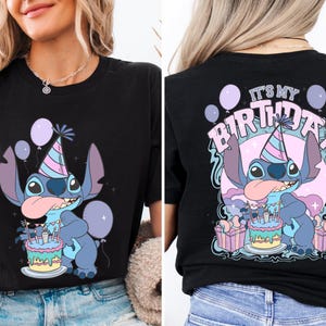 a woman wearing a black shirt with a cartoon character on it